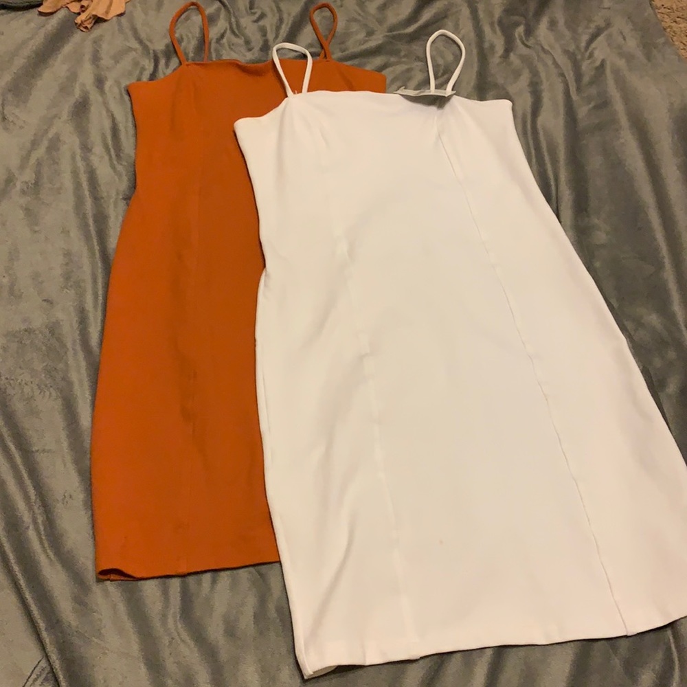 2 body con dresses. Never worn. Above the knee fitted/stretch